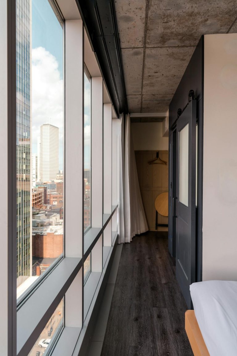 Urban hotel room with panoramic views of the Boston skyline.